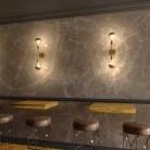 Fermaluce Metal, lampada a muro in metallo con doppia estensione curva