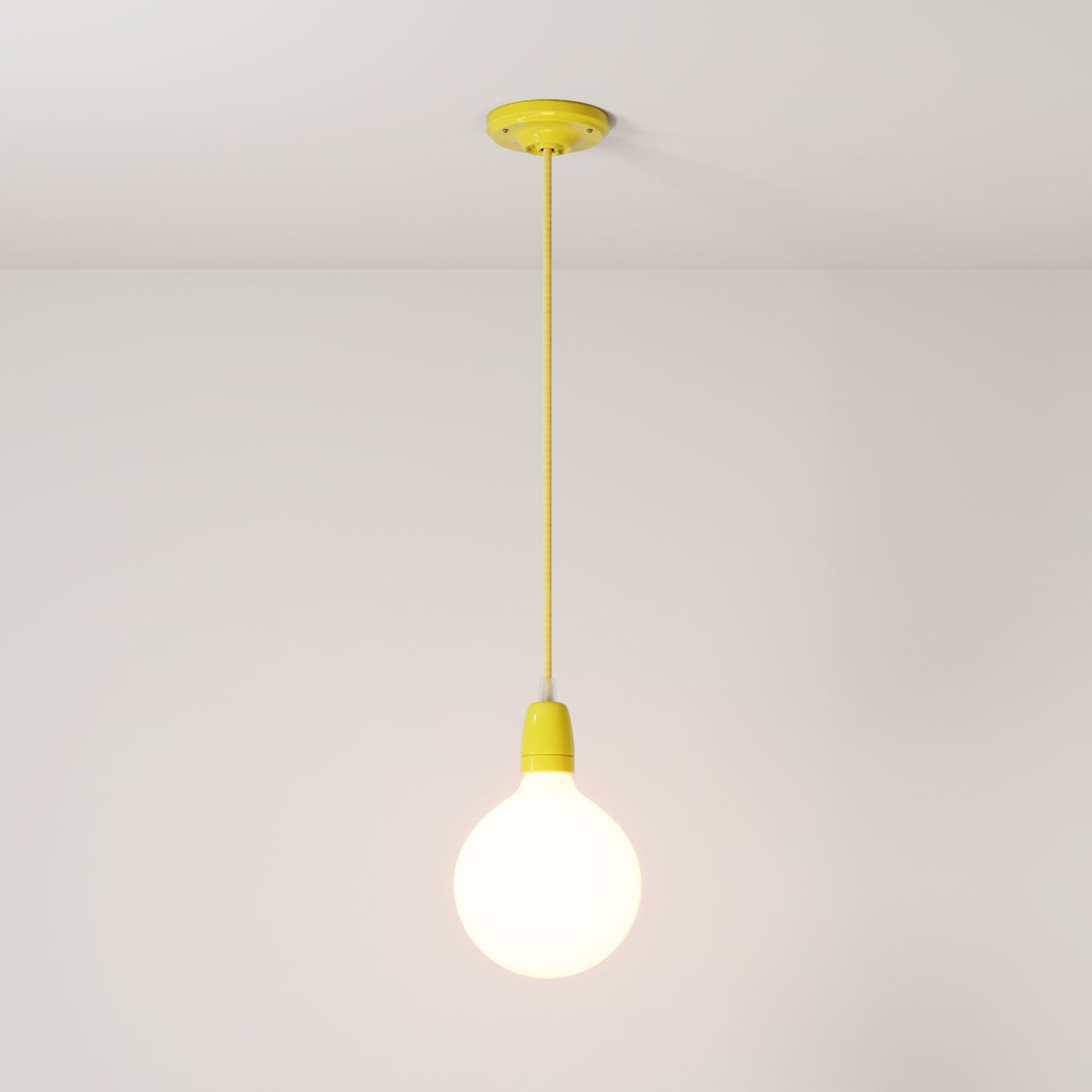 Lampada a sospensione completa di cavo tessile e finiture in porcellana colorata - Giallo
